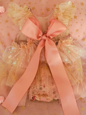 Back of a of a floral event dress for children perfect for special occasions such as wedding, birthdays or family photos.