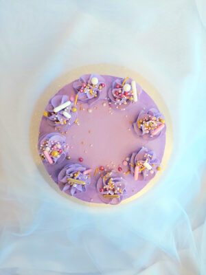 Birthday and party celebration cake with coloured Swiss meringue buttercream, handcrafted in Cambridge, New Zealand.