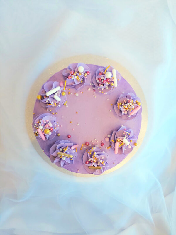 Birthday and party celebration cake with coloured Swiss meringue buttercream, handcrafted in Cambridge, New Zealand.