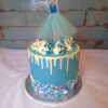 Frozen themed cake with a Elsa character on top