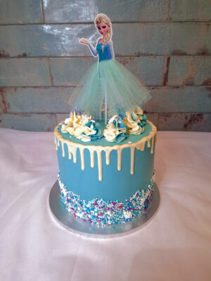 Frozen themed cake with a Elsa character on top