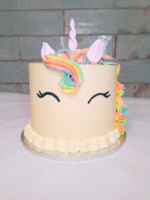 Unicorn birthday cake with rainbow mane and fondant horn from Mane and Tusk, Cambridge NZ