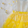 Yellow and white children’s occasion dress with daisy tulle skirt and shoulder details