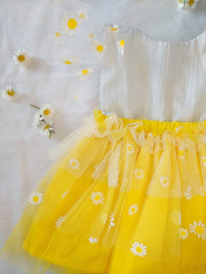 Yellow and white children’s occasion dress with daisy tulle skirt and shoulder details