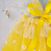 Yellow and white children’s occasion dress with daisy tulle skirt and shoulder details