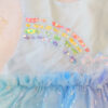 Pastel rainbow children’s occasion dress with sequin rainbow bodice and large rainbow bow at the back